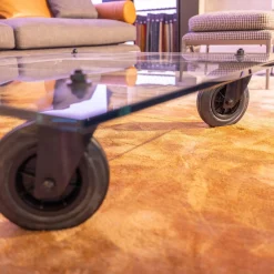 Couchtisch Tavola con Ruota Grande, Design Gea Aulenti 1980, geschliffenes Glas 15 mm, Gestell Rollen schwarz