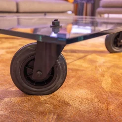 Couchtisch Tavola con Ruota Grande, Design Gea Aulenti 1980, geschliffenes Glas 15 mm, Gestell Rollen schwarz