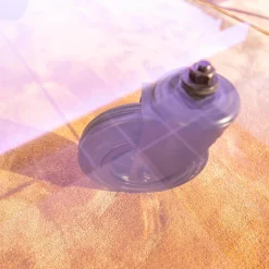 Couchtisch Tavola con Ruota Grande, Design Gea Aulenti 1980, geschliffenes Glas 15 mm, Gestell Rollen schwarz