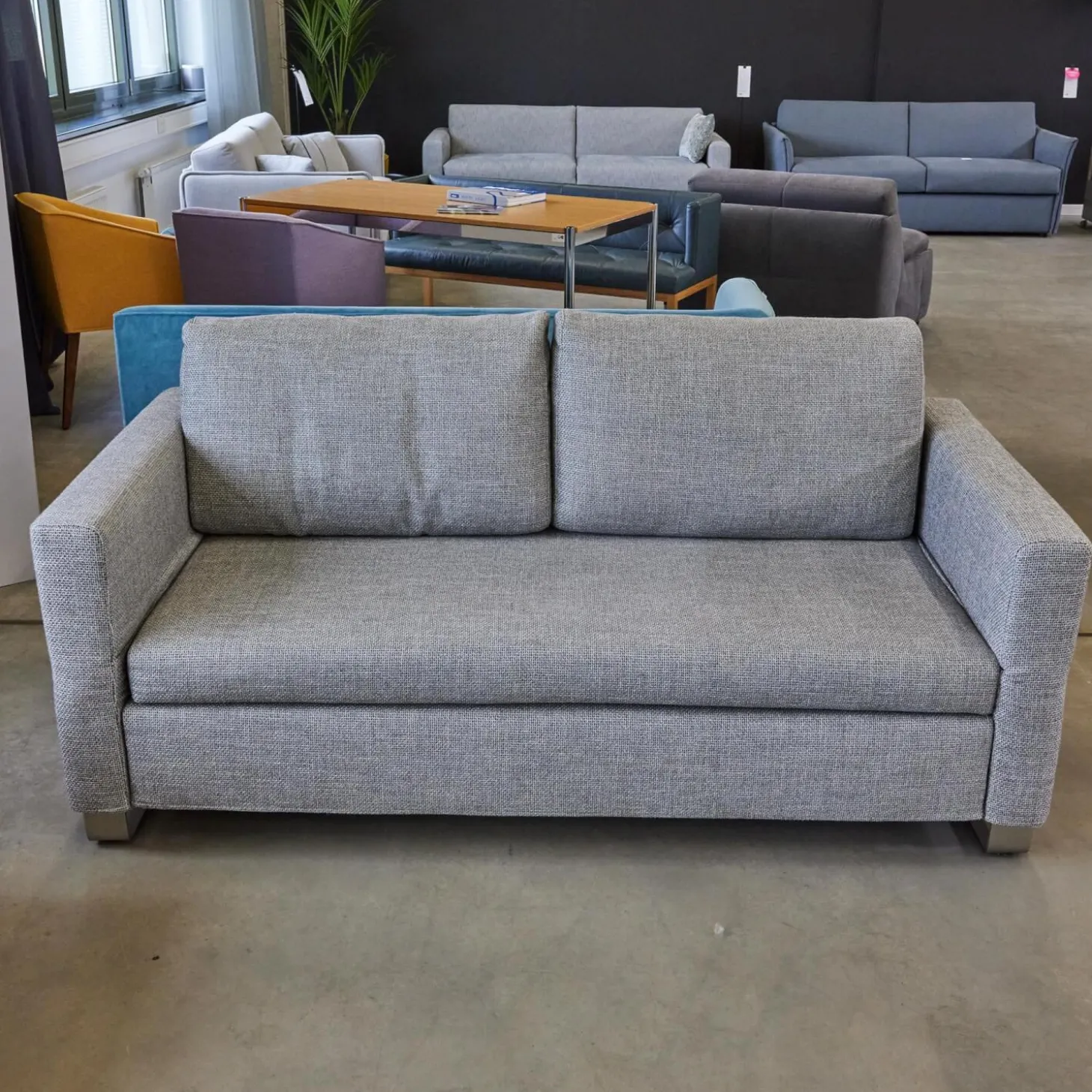 Schlafsofa Lazlo Stoff Mambo Hellgrau Kufe Edelstahl Gebürstet